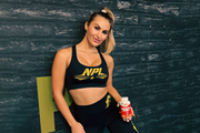 NPL athlete holding a vita C+ , blog post discusses why you should take your vitamins