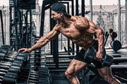 Athlete doing a one arm row, Blog is discussing how bad posture can affect your physique and performance in the gym