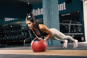 NPL athlete monique doing a tricep pushup, blog post is discussing how to create a consistent workout routine